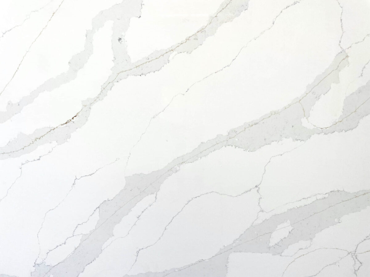 White marble countertop with gray veining pattern.
