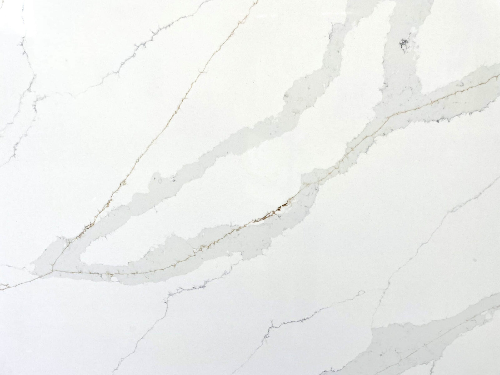 White marble countertop with subtle gray veining.