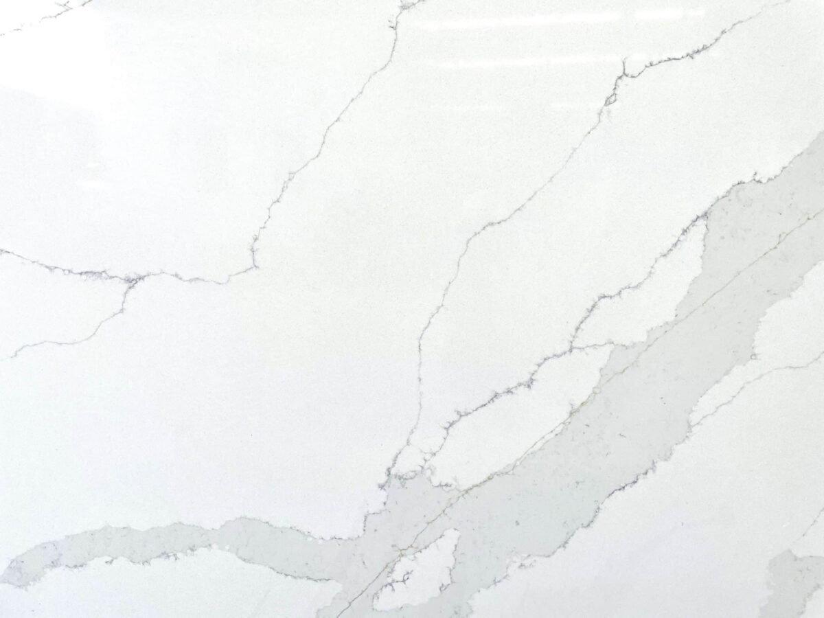 White marble countertop with subtle gray veining.