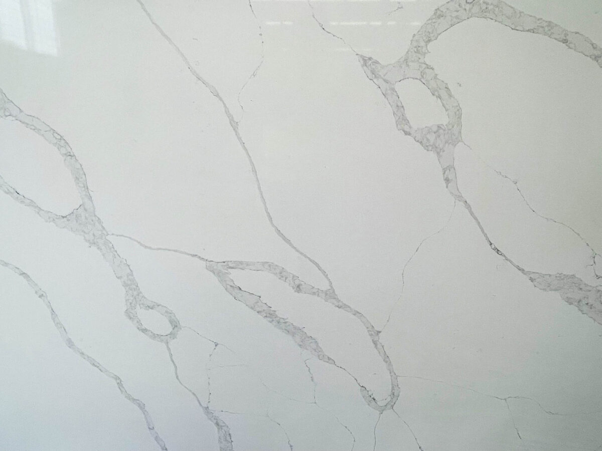 White marble countertop with subtle gray veining pattern.