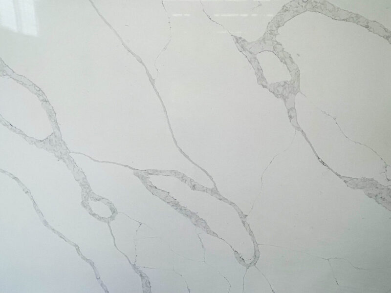 White marble countertop with subtle gray veining pattern.