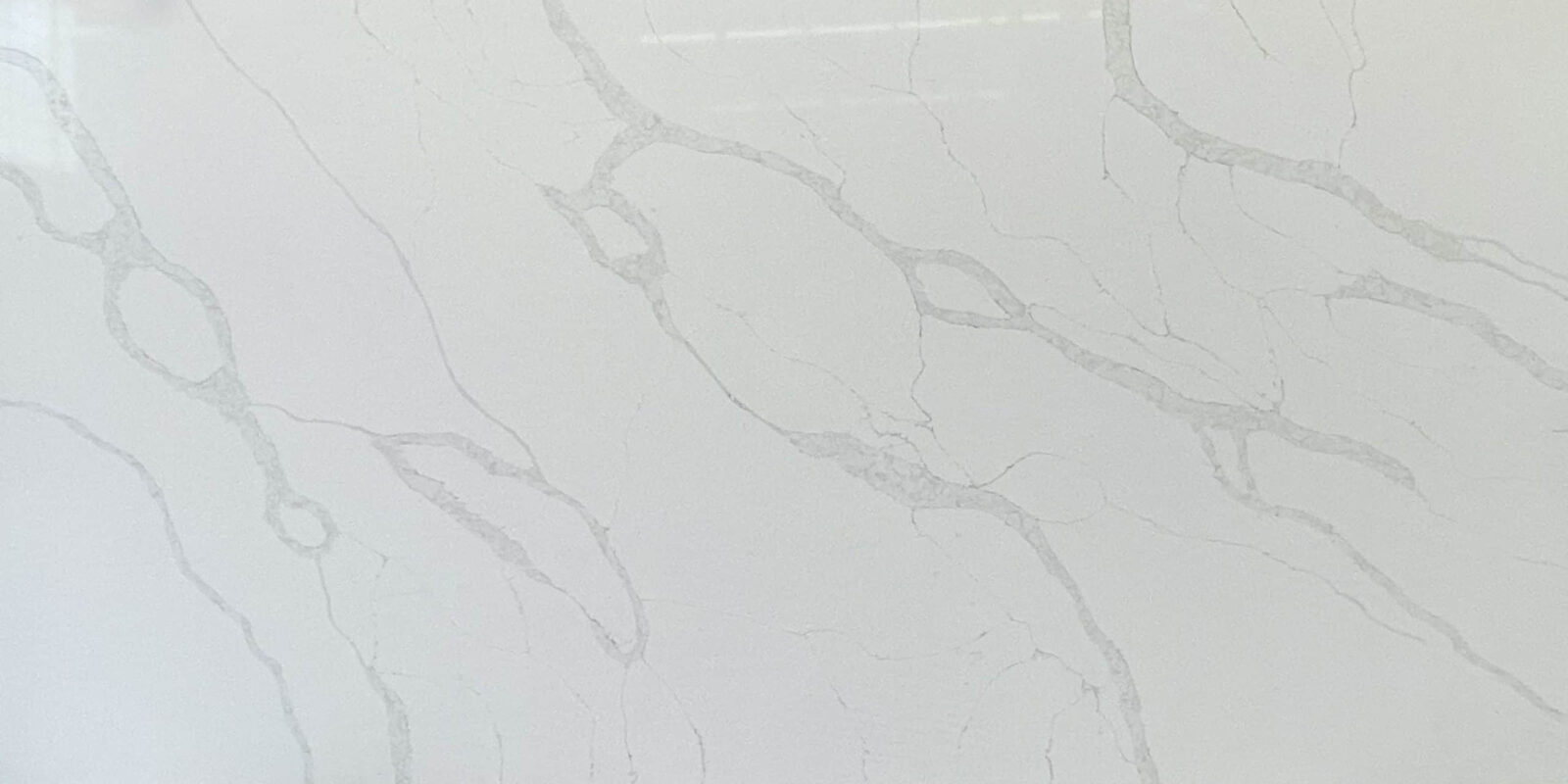 White marble countertop with subtle gray veining.