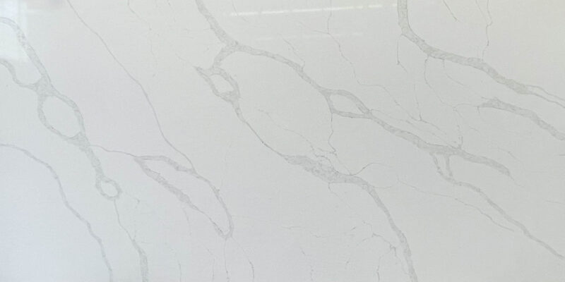 White marble countertop with subtle gray veining.