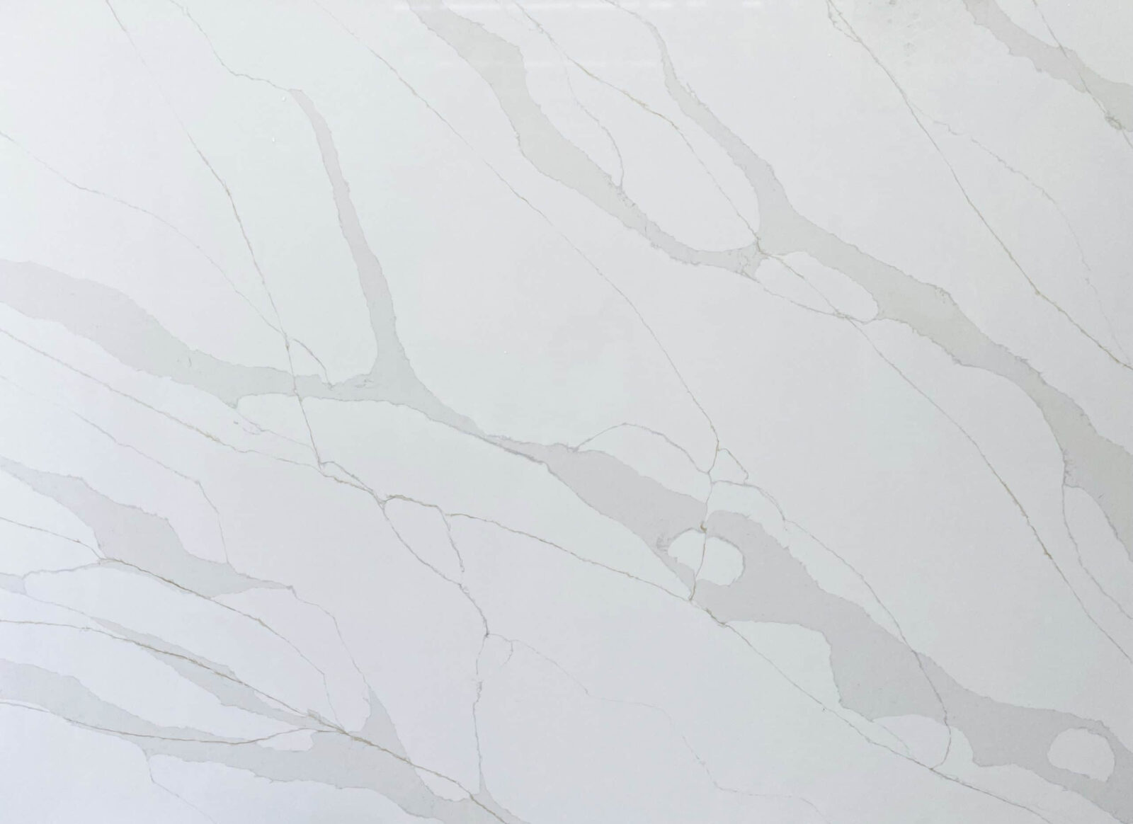White marble countertop with subtle gray veining.
