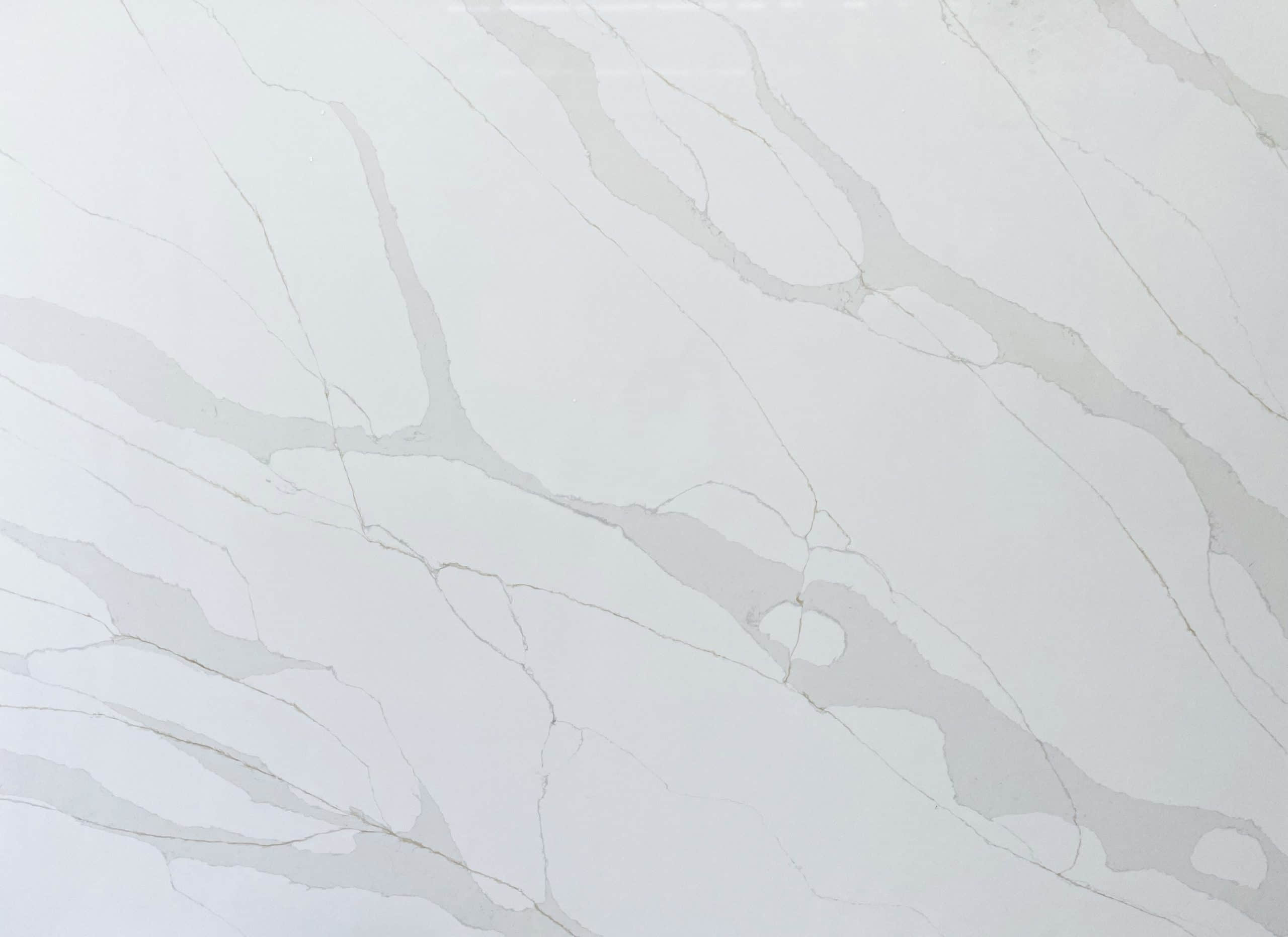 White marble countertop with subtle gray veining.