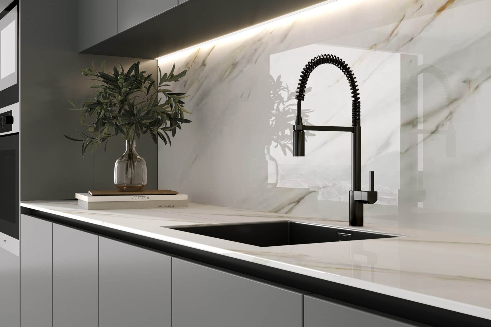 Modern kitchen with marble backsplash and sleek black faucet.