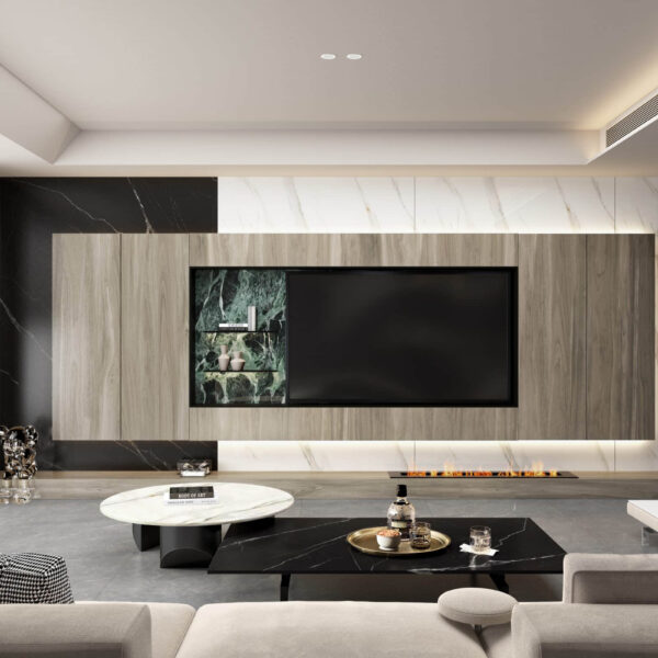 Modern living room with large TV, marble accents, and sleek furniture.