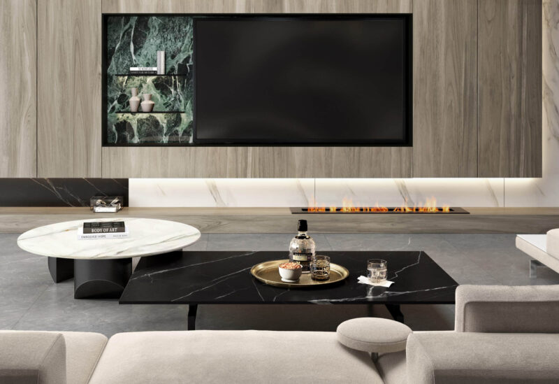 Modern living room with marble coffee table and wall-mounted TV.