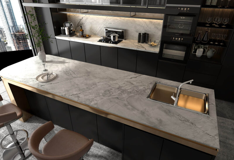 Modern kitchen with gray marble countertop and sleek black cabinets.