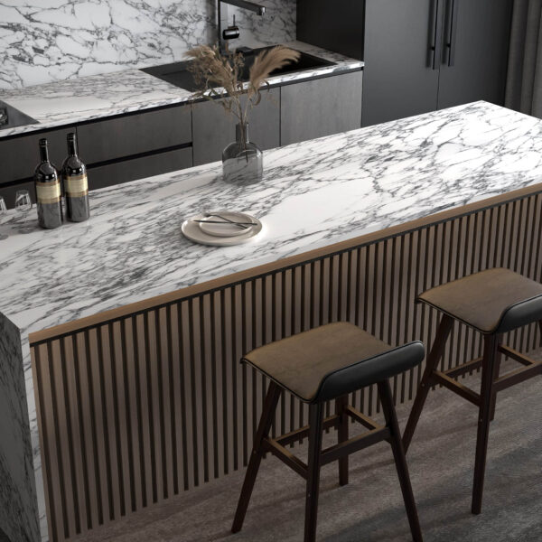 Modern kitchen with marble countertop and two stools.