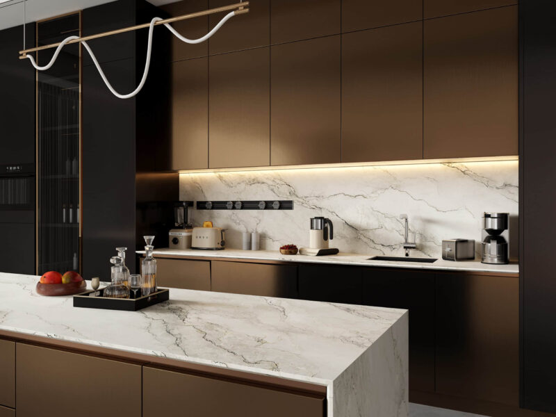 Modern kitchen with marble countertops and brown cabinets.