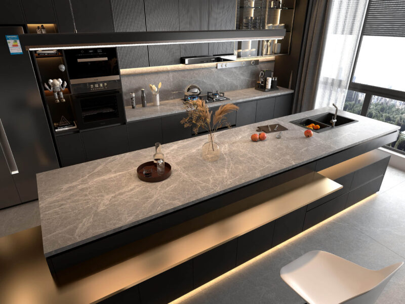 Modern kitchen with gray countertop and sleek appliances.