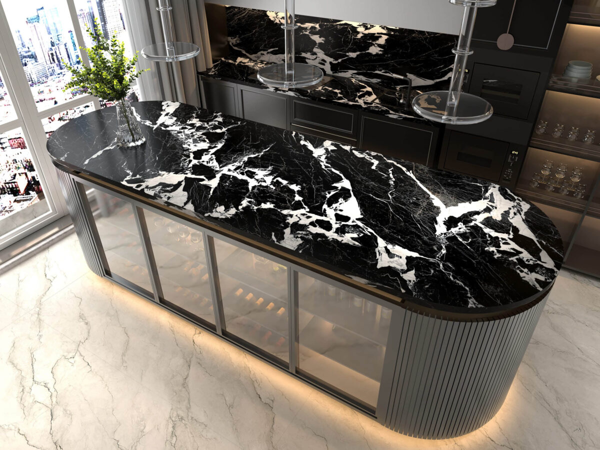 Black marble kitchen countertop with white veining, modern design.