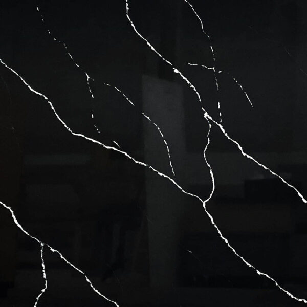 Black marble countertop with white veining pattern.