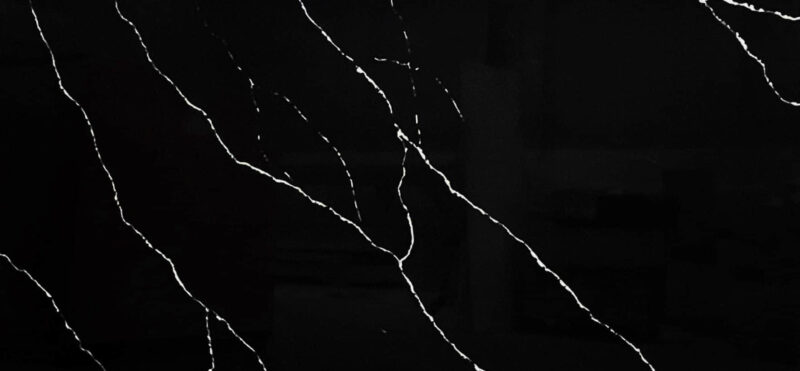 Black marble countertop with white veining pattern.