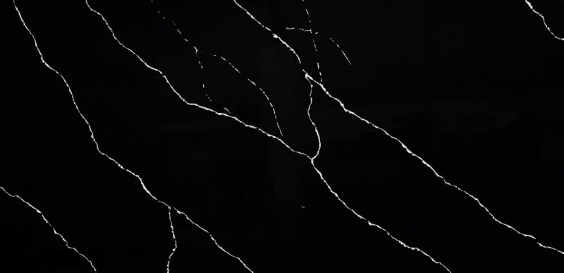 Black marble countertop with white veining pattern.