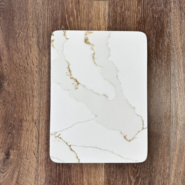 Marble-patterned rectangular plate on wooden surface.