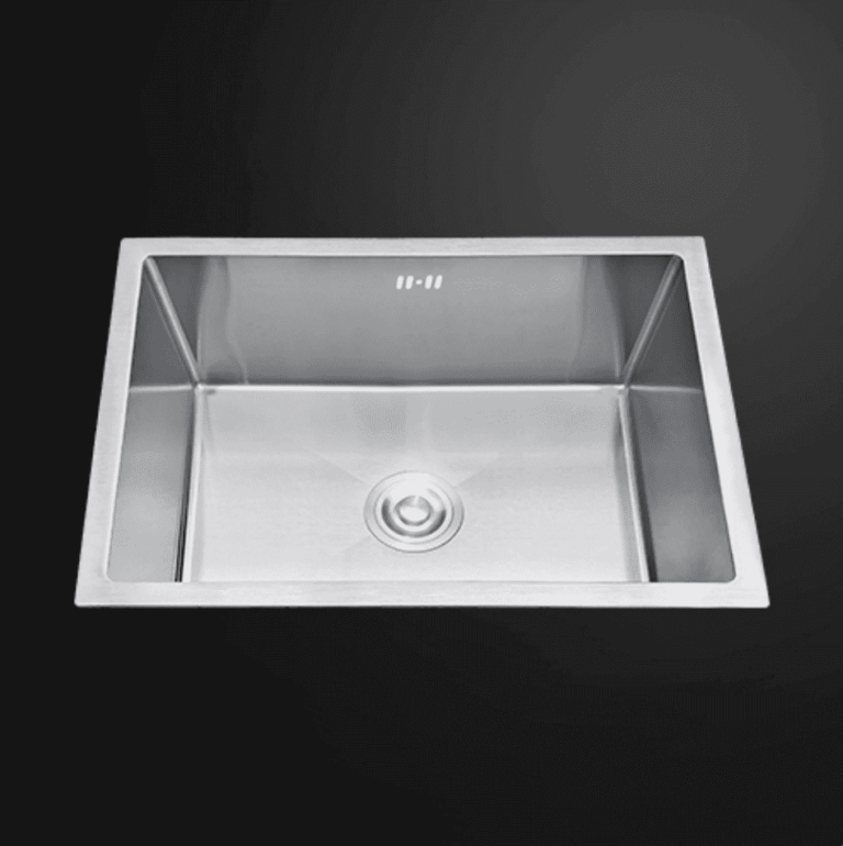 Stainless steel kitchen sink on a dark background.