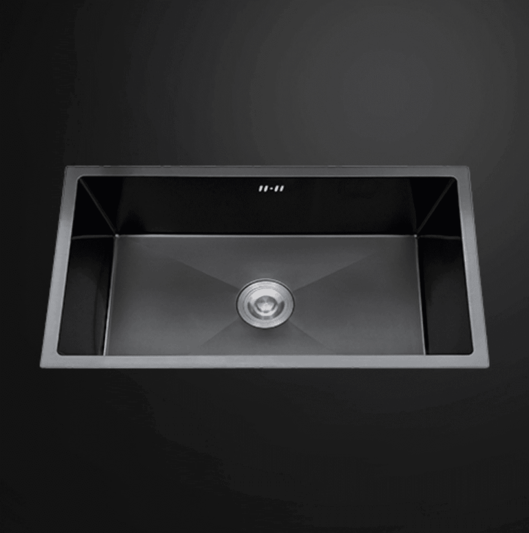 Stainless steel kitchen sink with modern design on dark background.