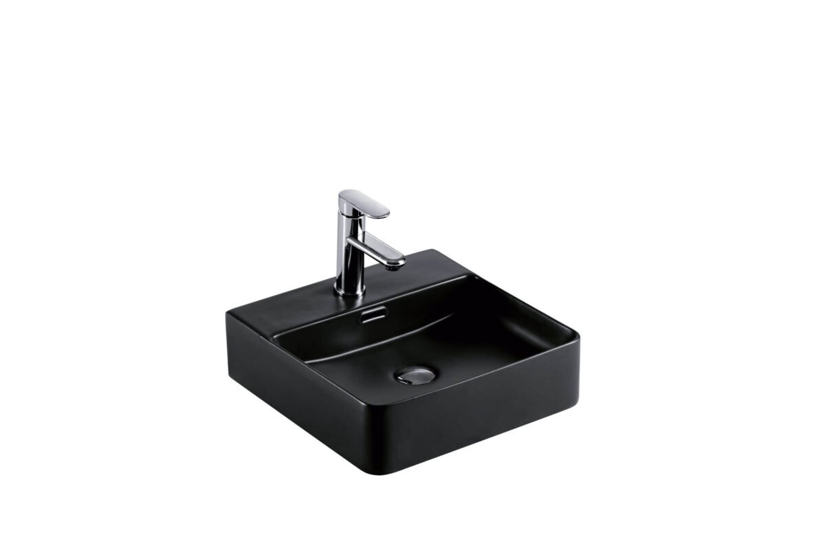 Black square bathroom sink with chrome faucet.