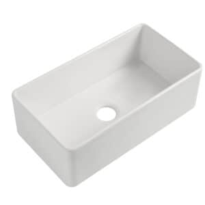 White rectangular ceramic kitchen sink with central drain hole.