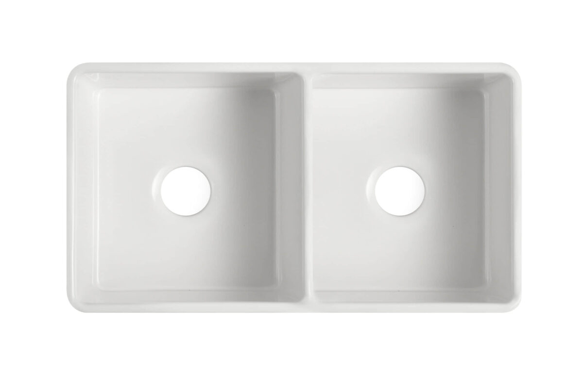 Double bowl white ceramic kitchen sink, top view.