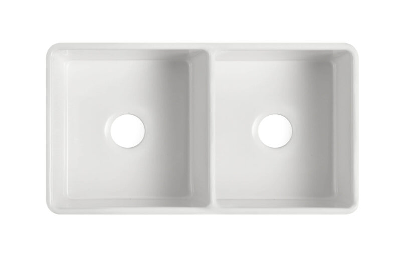 Double bowl white ceramic kitchen sink, top view.