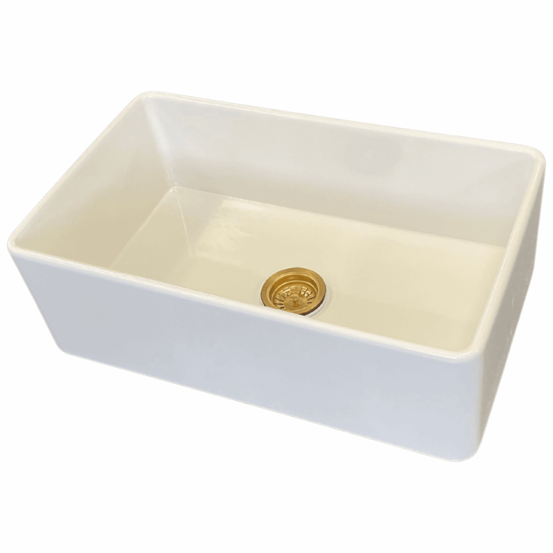 White medium butler sink with gold drain plug.