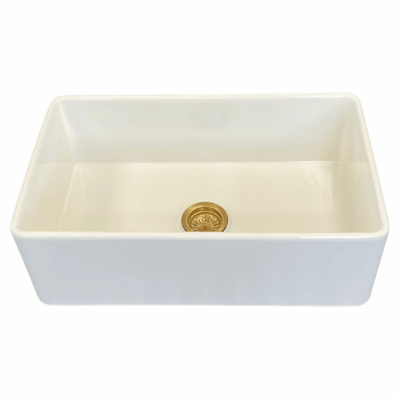 White medium butler sink with gold drain.