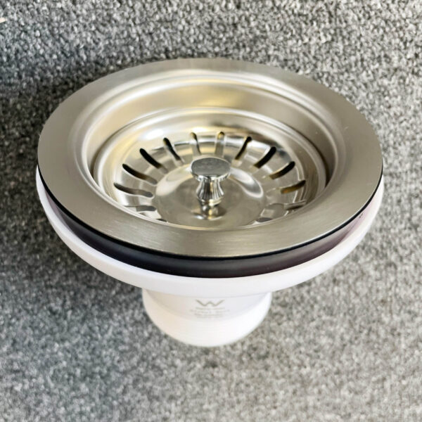 Stainless steel sink strainer, chrome color, vertical view.