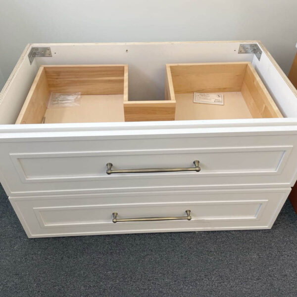 White Eden Shaker wall-hung vanity with two drawers and metal handles.