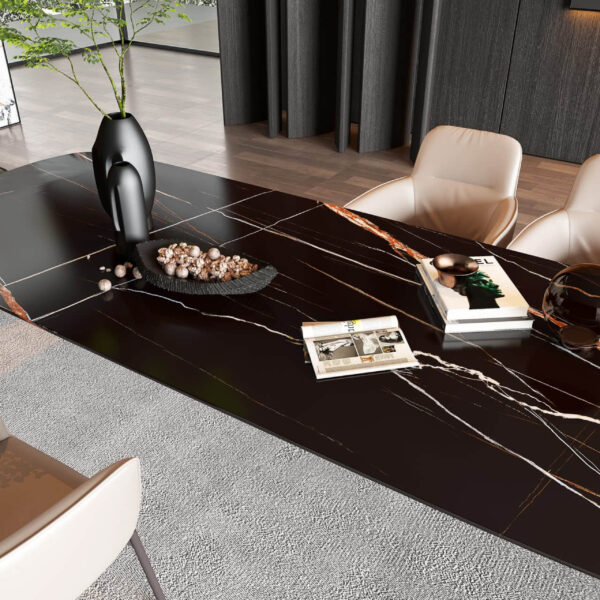 Modern black dining table with decorative items and chairs in a stylish room.