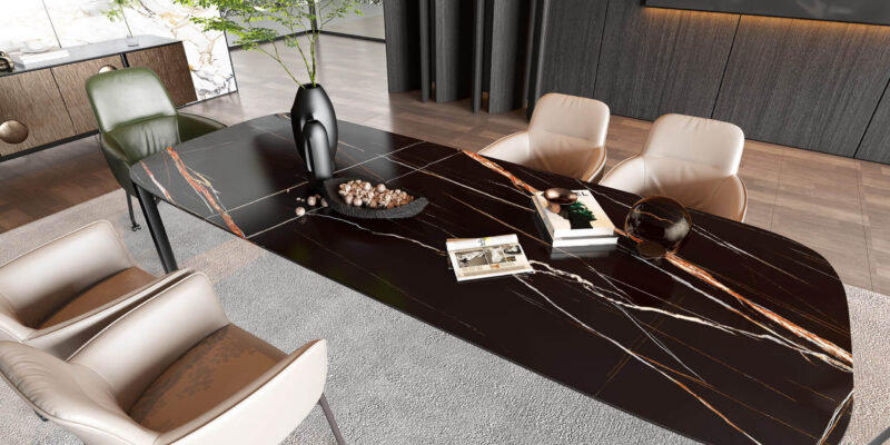 Modern black dining table with decorative items and chairs in a stylish room.