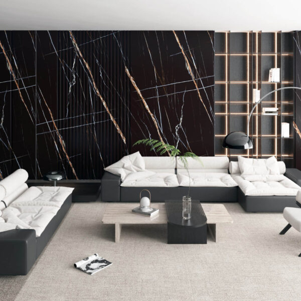 Modern living room with black marble accent wall and contemporary furniture.