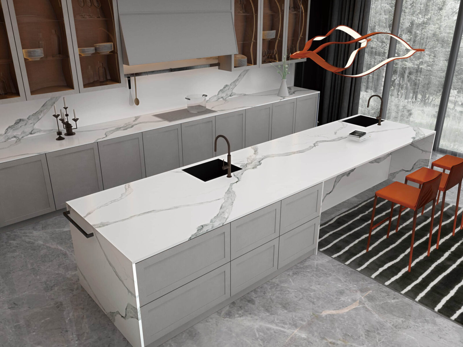 Modern kitchen with marble countertops and orange chairs.