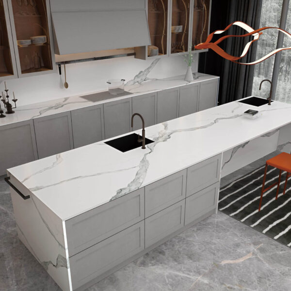 Modern kitchen with marble countertops and orange chairs.