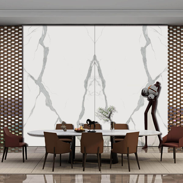 Dining room with marble wall panels and modern decor.