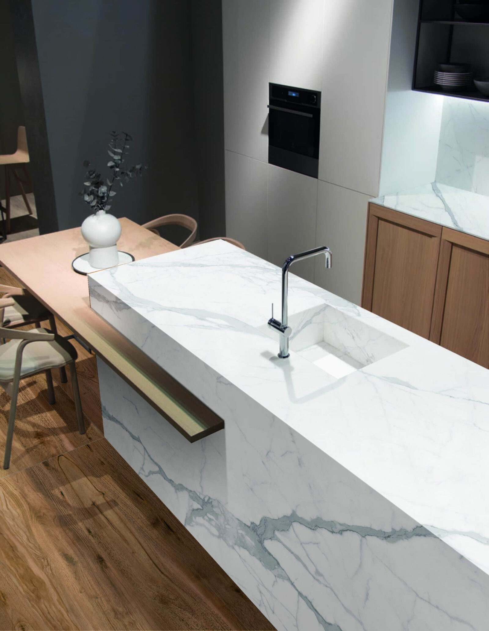 Modern kitchen with marble countertop and integrated sink.