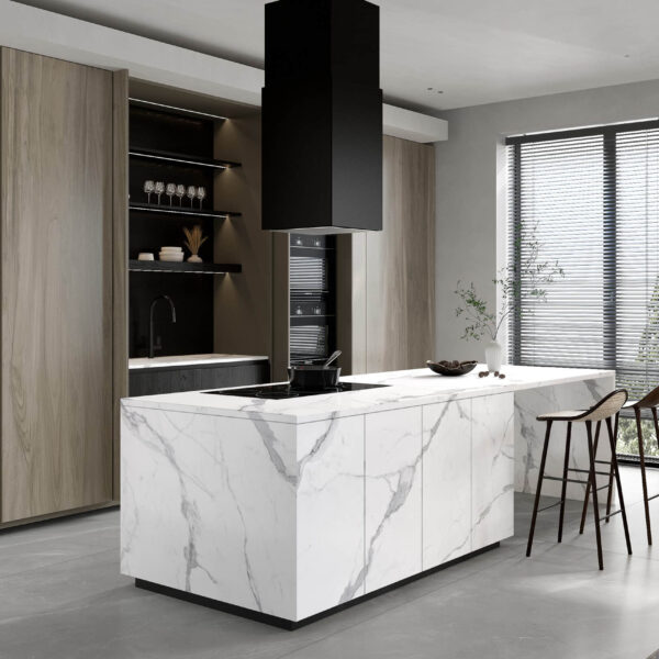 Modern kitchen with marble island, wooden cabinets, and bar stools.