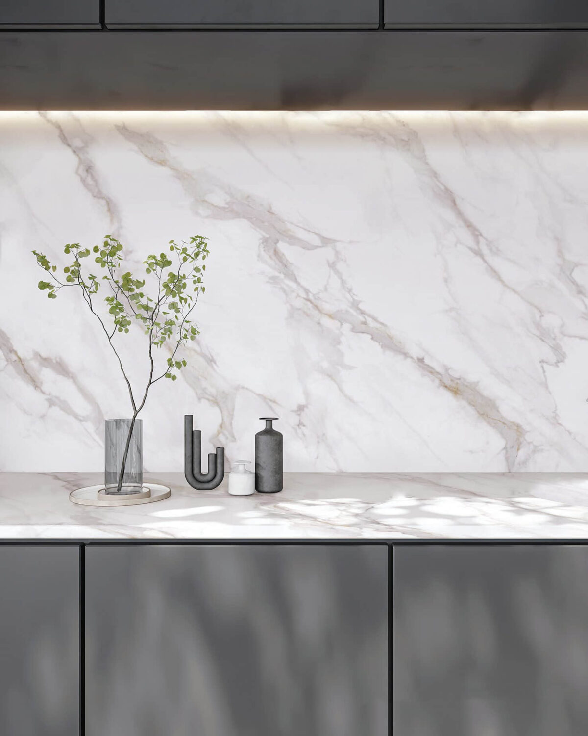 Marble countertop with vase and decorative items.