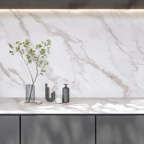 Marble countertop with vase and decorative items.