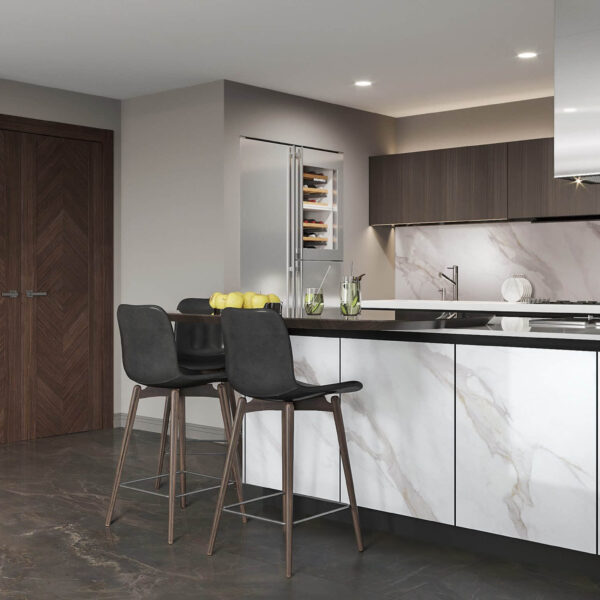Modern kitchen with marble countertops and bar stools.