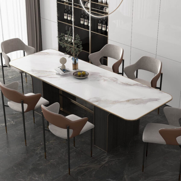 Modern dining room with marble table and six chairs.